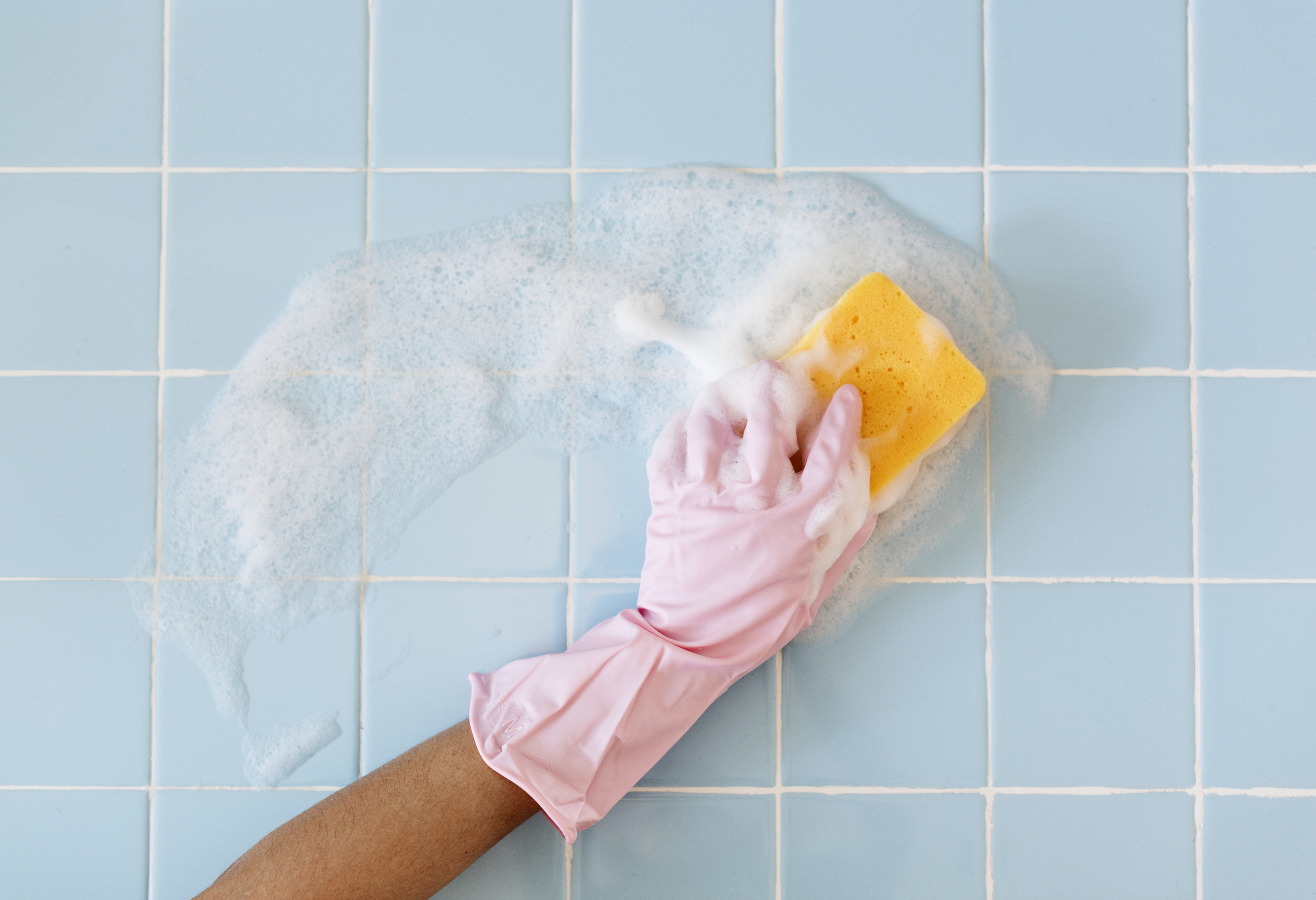 Pink glove and sponge cleaning